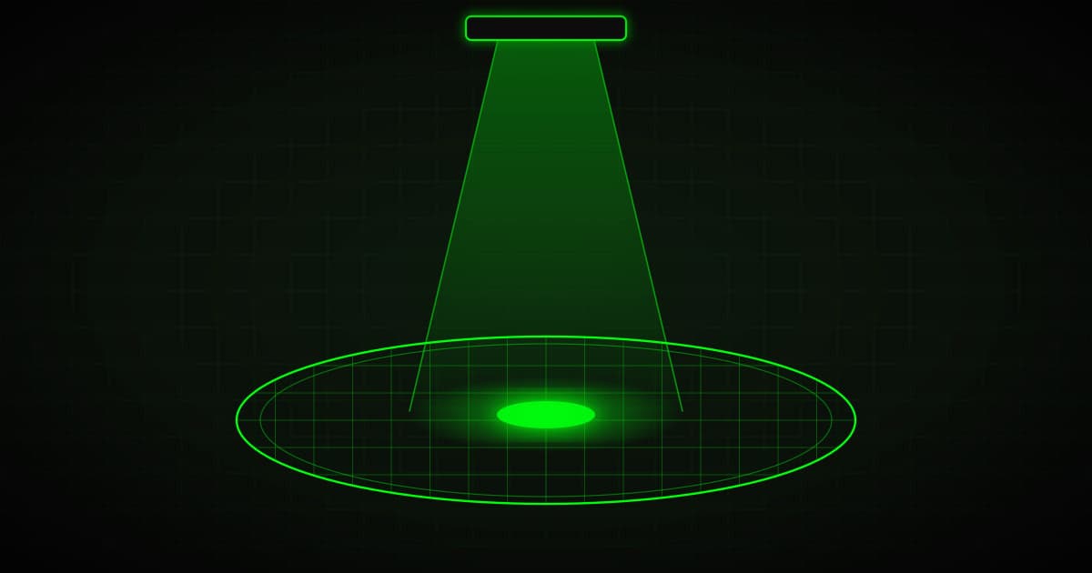 Silicon wafer under a lithography light beam, green on black